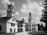 Meeting House, School and Church Buildings Along Dirt Road in Small Rural Town