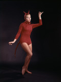 Woman Dancing in Red Devil Costume Photographic Print