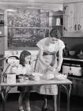 Mother and Daughter at Kitchen Table, Preparing Ingredients in Mixer For Baking
