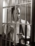 Man Gripping Bars