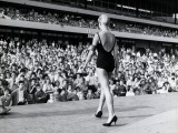 Female Competitor in Beauty Contest, Wearing One-Piece Bathing Suit and Heels