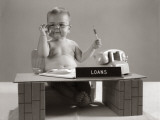 Baby at Desk Playing Loan Officer
