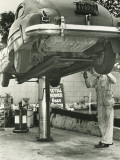 Buy Man Repairing Uplifted Car, Low Section at AllPosters.com