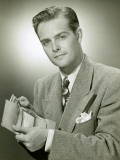Portrait of Man Placing Money in Wallet