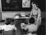 Teacher and Primary School Students in Classroom