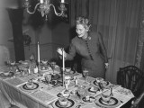 Woman Lighting Up Candle, Table Ready For Dessert