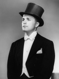 Man Wearing Tuxedo and Top Hat Posing in Studio