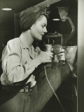 Woman Working With Electric Drill in Factory