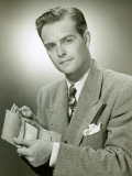 Portrait of Man Placing Money in Wallet
