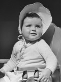 Baby Girl (12-18 Months) in Bonnet Looking Away