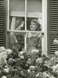 Woman Adjusting Widow Blind