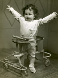 Baby in Walker With Hands Up