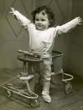Baby in Walker With Hands Up