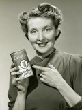 Woman Holding Can of Tomato Juice