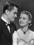 Man in Tuxedo Looking at Woman Photographic Print