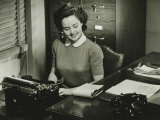 Young Woman Typing at Office