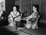 Two Japanese Female Musicians, One Playing Drum, the Other Playing Shamisen