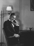 Man in Dinner Suit Sitting Indoors, Talking on Telephone