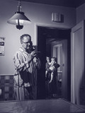 Parents With an Ill Daughter Calling a Doctor on the Telephone