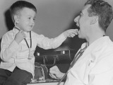 Pediatrician With Boy Holding Stethoscope