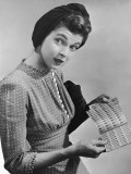 Woman Holding a Sheet of Wartime Ration Coupons