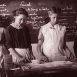 Two School Girls Baking in Home Economics Class