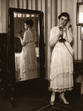 Woman Using Telephone, Standing By Mirror