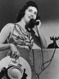 Young Woman Talking on Telephone, Low Angle View