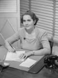 Portrait of Woman Sitting at Desk and Writing