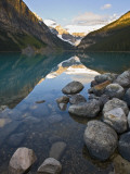 Rocky Mountains and Boulders Reflected in Lake Louise, Banff National Park, Alberta, Canada