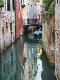 Reflections and Small Bridge of Canal of Venice, Italy