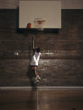 Young Boy Practicing his Basketball Shooting