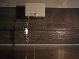 Young Boy Practicing his Basketball Shooting
