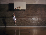 Young Boy Practicing his Basketball Shooting