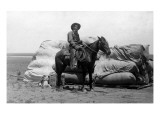 Kansas - Cowboy on Horseback Smoking a Cigar