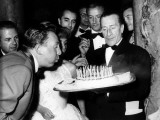 Charles Trenet on his 50th birthday with Jeanne Moreau and Michelangelo Antonioni
