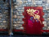 Derelict Door with Graffiti and Lampost