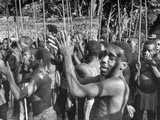 Local Community Members Dancing a Tribal Dance for the Outsiders During Expedition