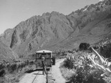 An Auto-Carrill Driver Stopping on the Railway Tracks to Catch a Breath of Fresh Air