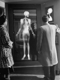 Men Looking at an Xray of a Skeleton