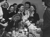 Bride-To-Be Opening Gifts from Friends at Her Bridal Shower
