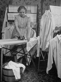 Wife of Rev. Dr. Edwin A. Briggs, Pastor of First Methodist Church, Ironing Her Husband