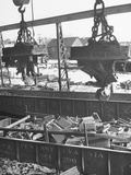 Giant Magnets Transporting Auto Scraps in Junkyard