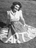 Buy A Woman Wearing a Skirt That Says "Macarthur" in Honor of General Douglas Macarthur at AllPosters.com