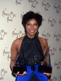 Singer Natalie Cole Holding Her Awards in Press Room at American Music Awards