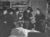 Buy Eleanor Roosevelt Looking at a Gingham Horse Sent Along with Glothing Gifts to Wvs in England at AllPosters.com