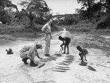Outsiders Buying Tobacco from the Local Children During their Exhibition for Hunting Gorillas