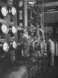 A Man Turning a Valve on the Compressor