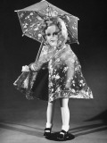 A Baby Doll's Pilofilm Raincoat and Umbrella Being Sold at F.A.O. Schwarz