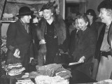 Buy Eleanor Roosevelt Visiting a Women's Volunteer Service Clothing Depot at AllPosters.com